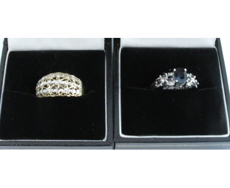 A 9 carat white gold sapphire and diamond ring, finger size N, 2.7g gross, together with a 9 carat gold dress ring, 2g gross