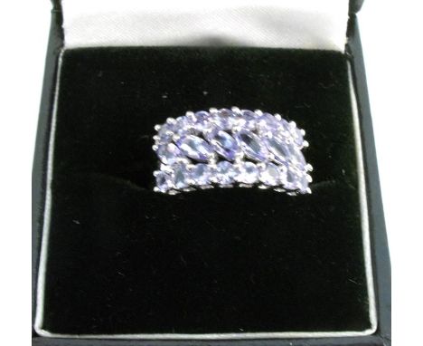 A 9 carat white gold twenty two tone tanzanite dress ring, finger size N, 3.6g gross