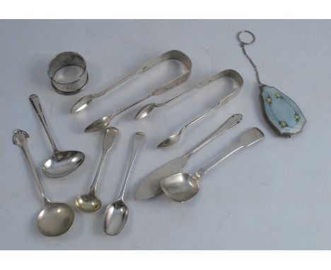 A collection of hallmarked silver flatware, to include sugar tongs, butter knife and various spoons, weight 6oz, together wit