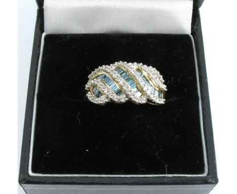 A 9 carat gold diamond and treated blue diamond dress ring, finger size N, 3.9g gross