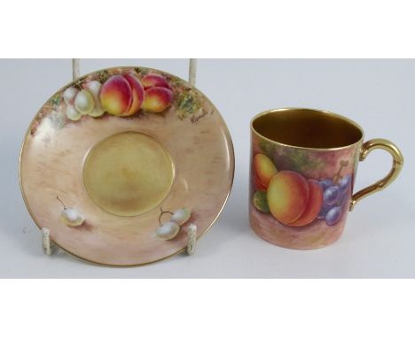 A Royal Worcester coffee can and saucer, the exterior of the can and the saucer painted with fruit to a mossy background by M