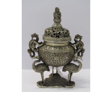 EASTERN METALWARE, a fine white metal incense burner supported on 3 cranes with twin dragon handles and dragon finial, 9"heig