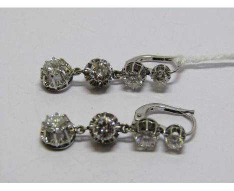 18CT WHITE GOLD DIAMOND DROP EARRINGS, each earring sporting 4 graduated transitional brilliant cut diamonds of good colour &