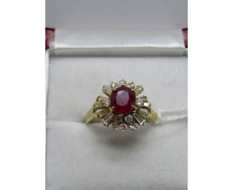 14CT YELLOW GOLD RUBY &amp; DIAMOND CLUSTER RING, the central oval cut ruby of approx. 1ct surrounded by baguette and brillia