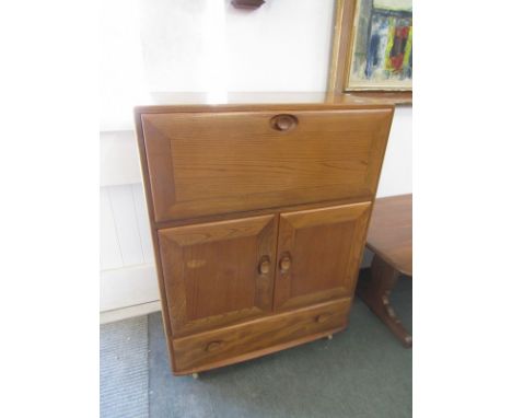 ERCOL FURNITURE, Ercol bureau/cabinet with fall&nbsp; front above two doors &amp; a drawer. Fitted interior. 43" x 32.5" appr