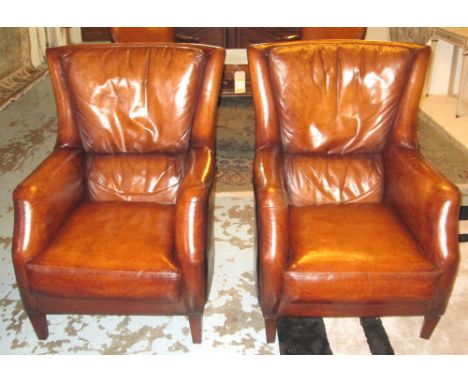 CLUB WING ARMCHAIRS, a pair, club style tan brown leather upholstered each with seat cushion and square tapering supports, 72