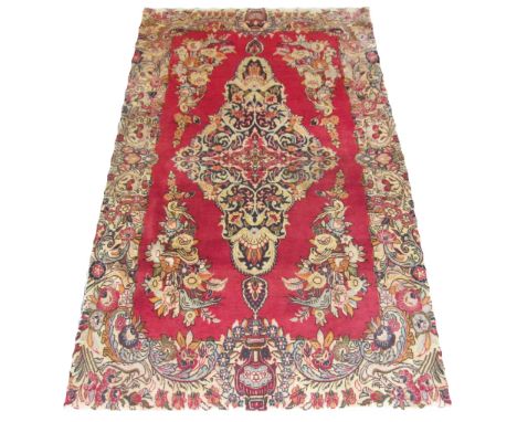 VINTAGE SAROUK, 200cm x 122cm, large amethyst and ivory central medallion on a cerise field decorated with birds and scrollin