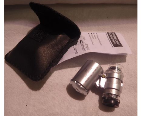 Cased 60x magnification currency jewellery loupe with LED light in working order, with instructions. P&amp;P Group 1 (£14+VAT