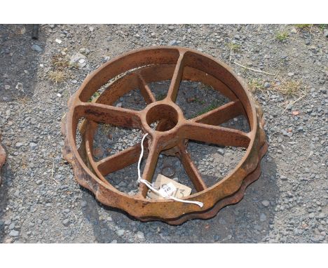 Two 19" cast roller rings with raised edges.