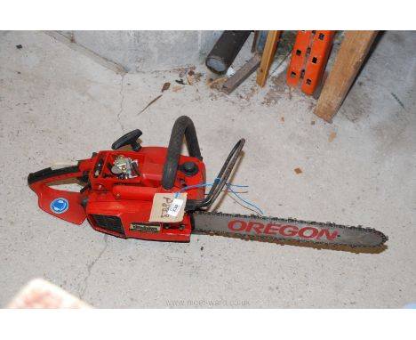 An Oregon chainsaw with brake (carburetor cover missing.) 