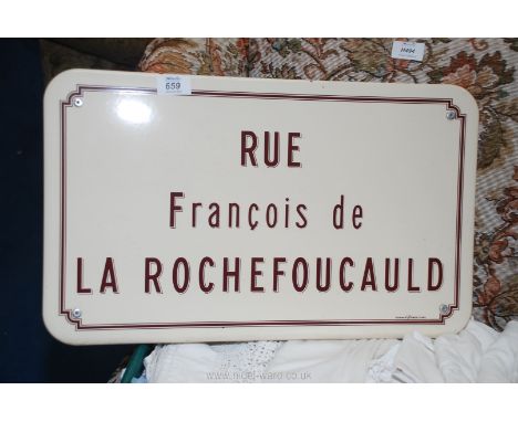 An enamel sign 'Rue Francois de la Rochefoucauld'.