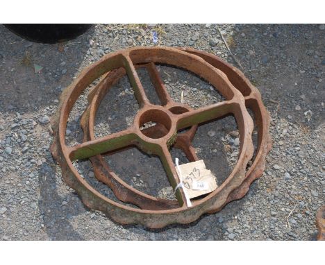 Two 19" cast roller rings with raised edges.