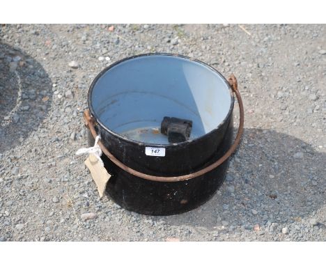 An enamel cook pot.