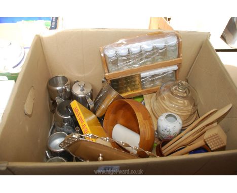 A box of kitchenware including glass cheese dome and board, meat tenderizer, spice rack, stainless steel, etc.