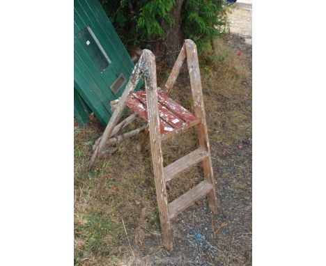 A two rung wooden step ladder.