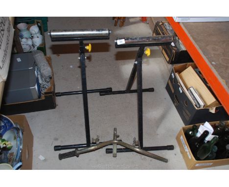 Two roller stands and handle bar.