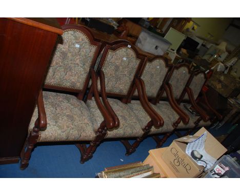 Ten tapestry fabric upholstered carver type dining chairs.