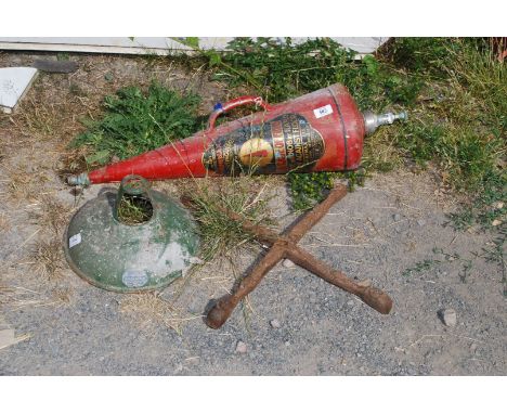 A vintage fire extinguisher and vintage Coolicon lamp shade.
