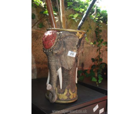 An "Elephant" stick stand containing two walking sticks, shoe horn, etc.