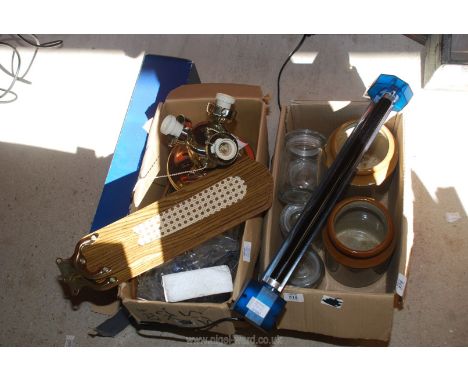 A ceiling fan, storage jars and a black light.