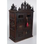 An spanish carved cedar and pine wooden cupboard with bronze fittings. 18th century.