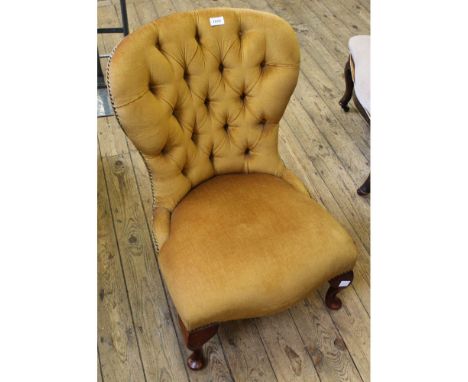 A Victorian style button back mustard upholstered nursing chair