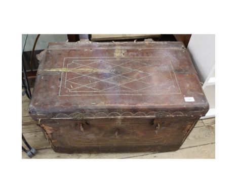 A leather and metal bound travelling trunk