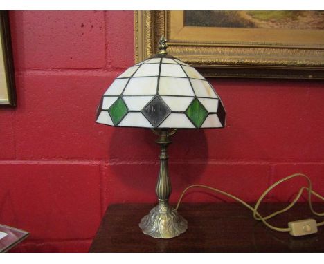 A Tiffany style table lamp with a white opaque shade