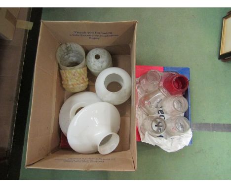 Two boxes containing various glass lamp shades