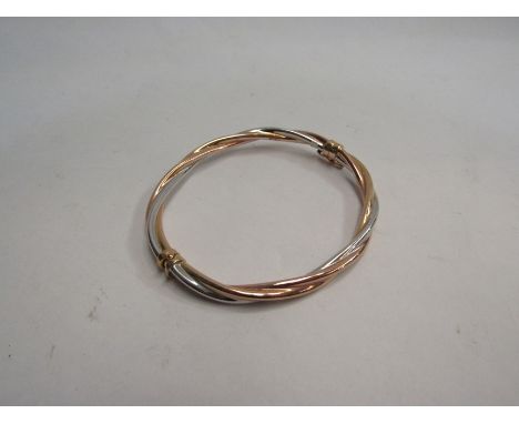 A three tone bangle marked 375