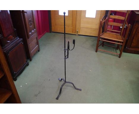 An adjustable rush light on cast tripod stand, 111cm tall