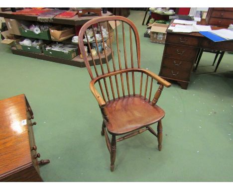 An elm seated stick back Windsor chair on turned front legs with 'H' stretcher base