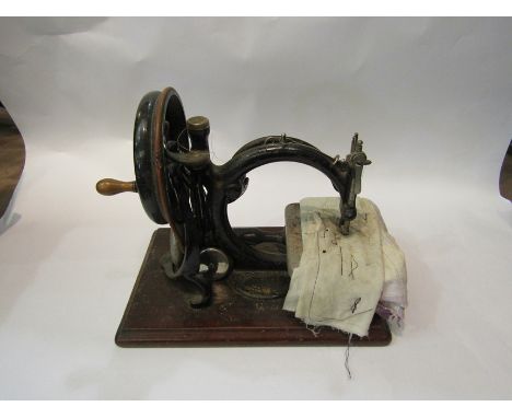 A Wilcox &amp; Gibbs vintage hand operated sewing machine