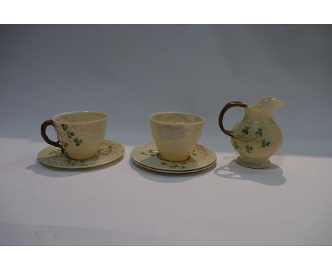 A small quantity of Belleek including porcelain jug, teacups and saucers (5) 