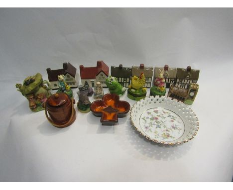 A collection of pottery houses including Greene King pubs, enamel pill boxes etc.