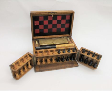 VICTORIAN GAMES COMPENDIUM an oak case containing a variety of games including a boxwood and ebony chess set (complete) and c