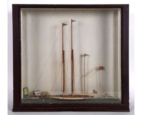 CASED MODEL YACHT 'DAUNTLESS' - ROYAL TORQUAY YACHT CLUB, 1925 a wooden model of a Schooner Yacht Dauntless, in a wooden and 