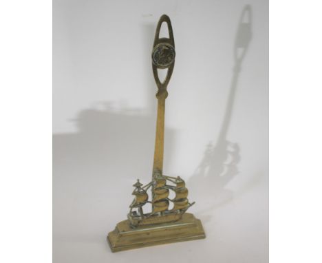 ADMIRAL NELSON - BRASS DOORSTOP, HMS VICTORY a brass doorstop with a depiction of Victory, with a portrait of Admiral Nelson 