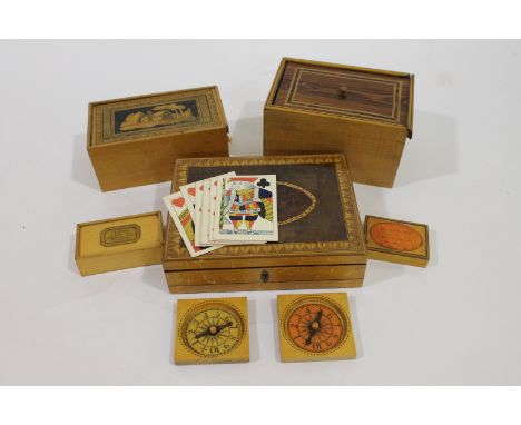 TUNBRIDGE BOXES A games box with two markers, cribbage board and playing cards, two boxes with sliding covers and two others 