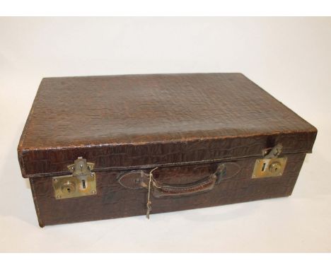 CROCODILE SKIN FITTED SUITCASE a crocodile skin suitcase with a fitted interior, containing a crocodile skin mirror and manic