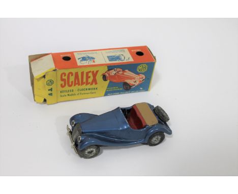 SCALEX M.G - BOXED a circa 1950's M.G TF boxed keyless clockwork model car.