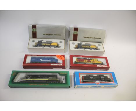 BOXED TRANSCONTINENTAL LOCOMOTIVES 6 boxed locomotives including Mantua Santa Fe 414-001, Model Power 6841 Alco, Mehano Atlan