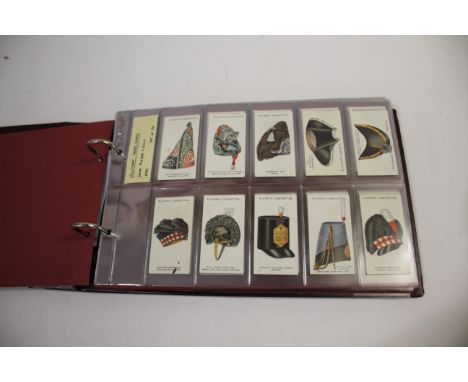 COLLECTION OF CIGARETTE CARDS including 4 albums, subjects include Players Military Head-Dress (set of 50), Players R.A.F Bad
