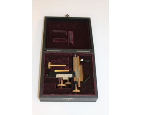 ERNST LEITZ - CASED MICROSCOPE STAGE a brass and metal mechanical stage, which can be attached to the body of a microscope. I