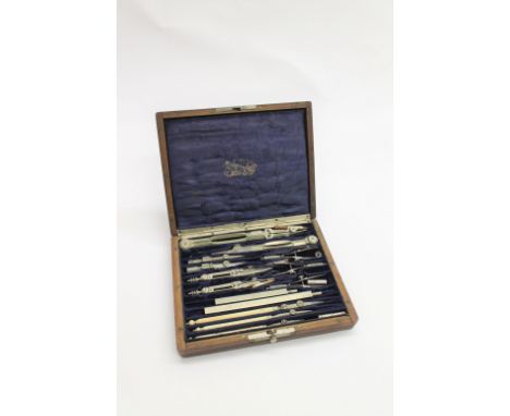 CASED GEOMETRY SET - STANLEY an oak case with a fitted interior and a variety of geometry instruments, the inside of the lid 