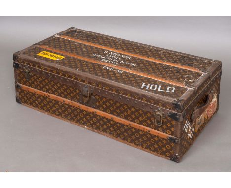 VINTAGE LOUIS VUITTON STEAMER TRUNK an early 20thc steamer trunk, the monogrammed case with wooden bars, metal studs and brac