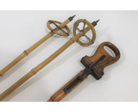 VINTAGE SHOOTING STICK &amp; SKI POLES a vintage wooden shooting stick with fold up seat supported by a metal mechanism. Also