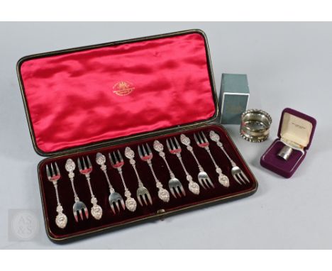 A Victorian cased set of twelve silver pastry forks with cherub mask finials on twist stems,&nbsp;Goldsmiths &amp; Silversmit