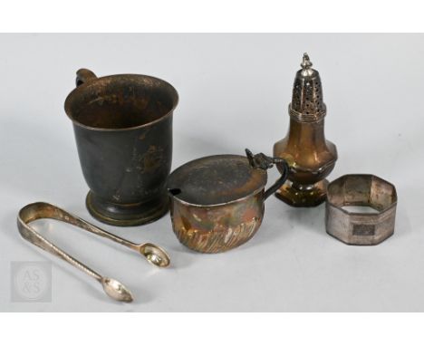 A silver Christening mug, baluster pepperette, mustard pot, feather-edge tongs and napkin ring - various makers and dates, 10