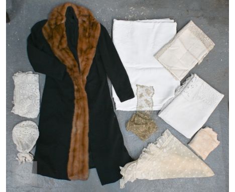 Antique and later lace and table linens to include bonnet, apron, napkins, table cloths, etc to/w a black woollen overcoat wi